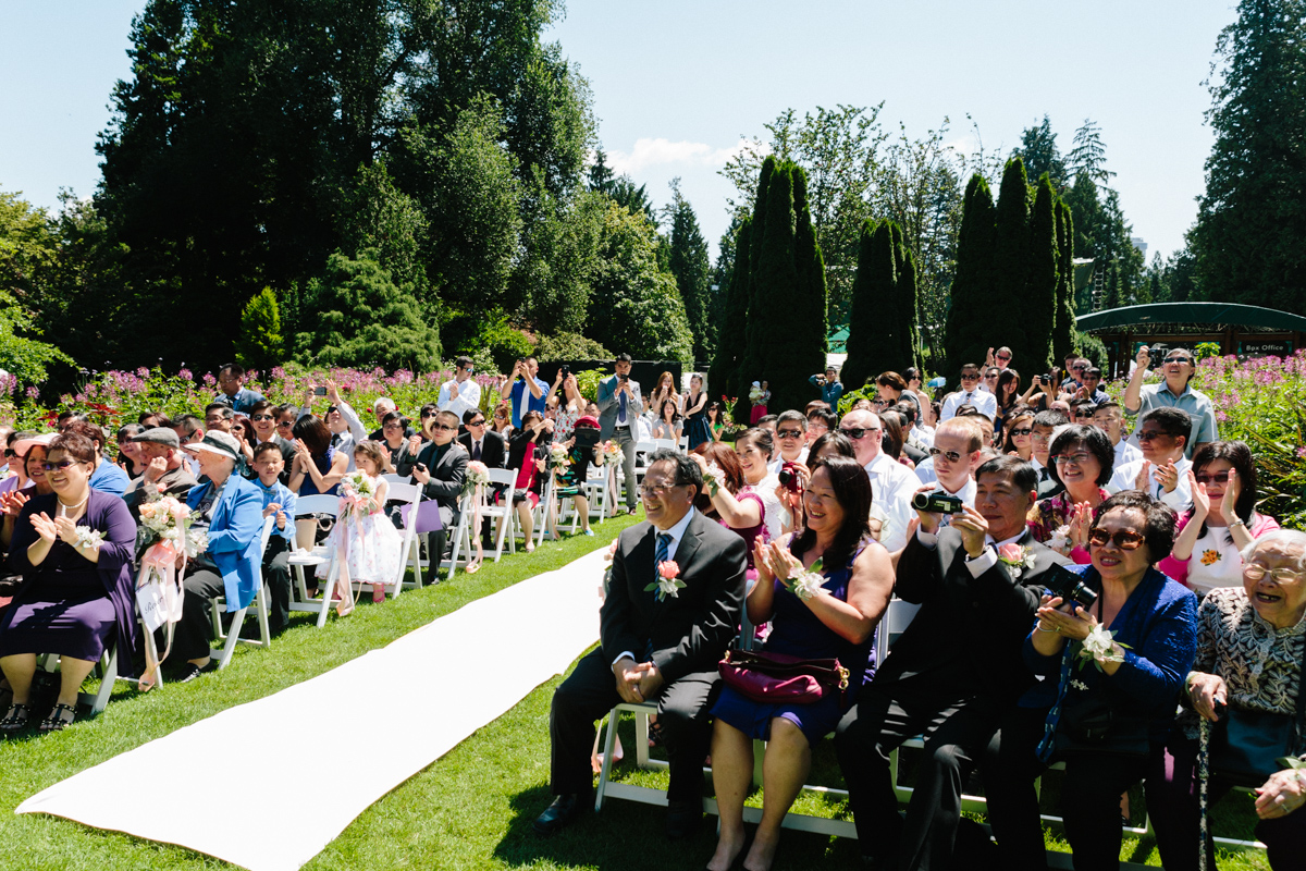 Guests excited to see the groom and bride in the wedding