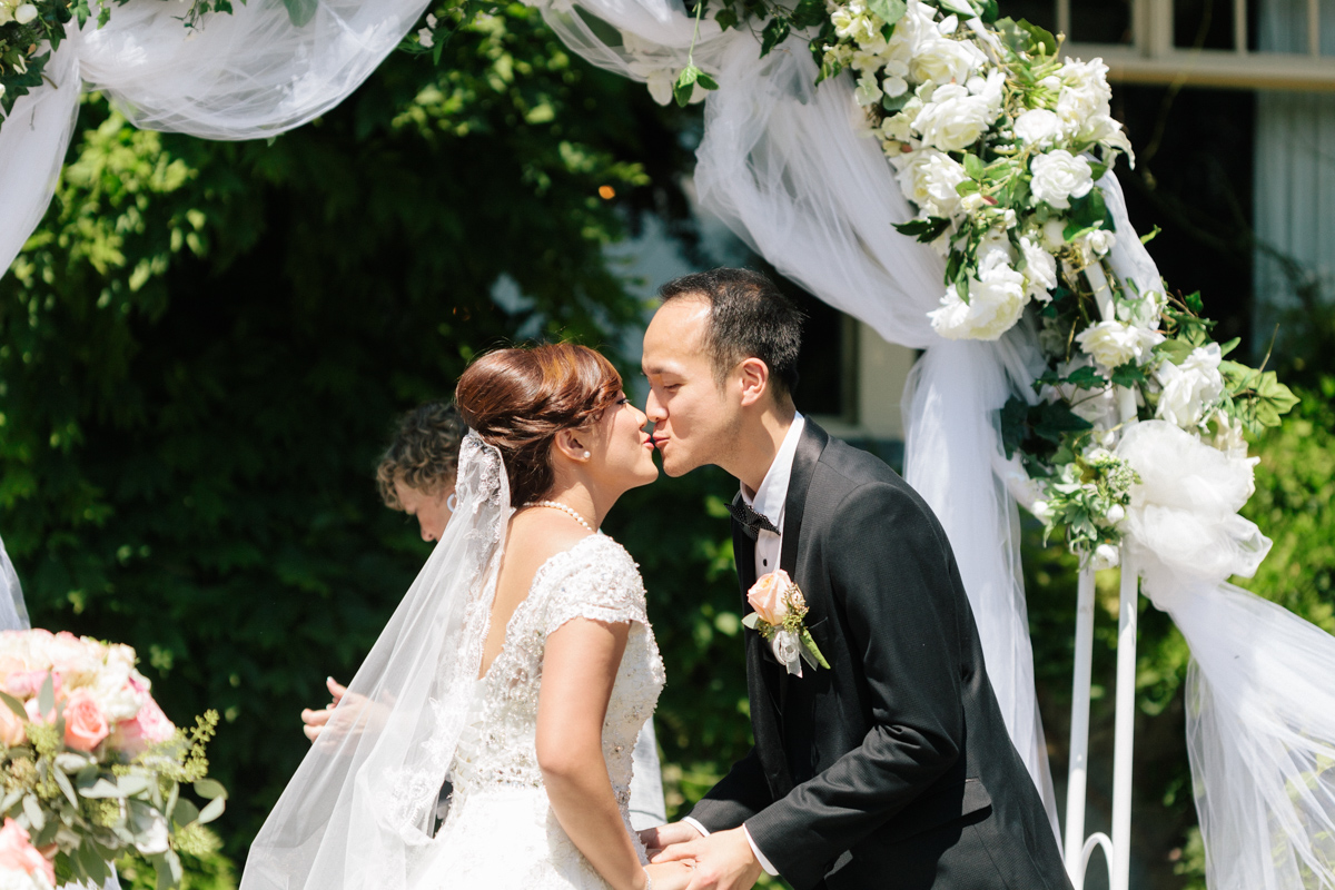 First kiss of the bride and groom (alternative angle)