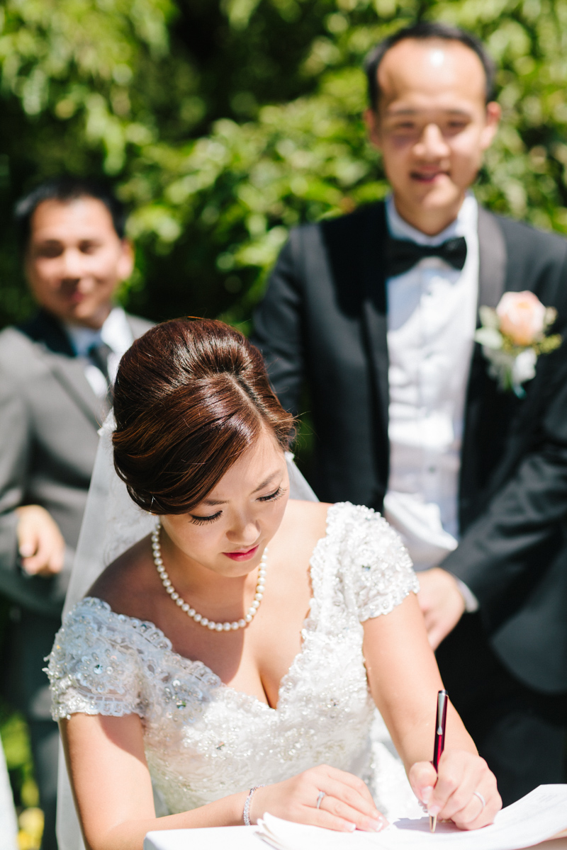 Bride signing the paper work