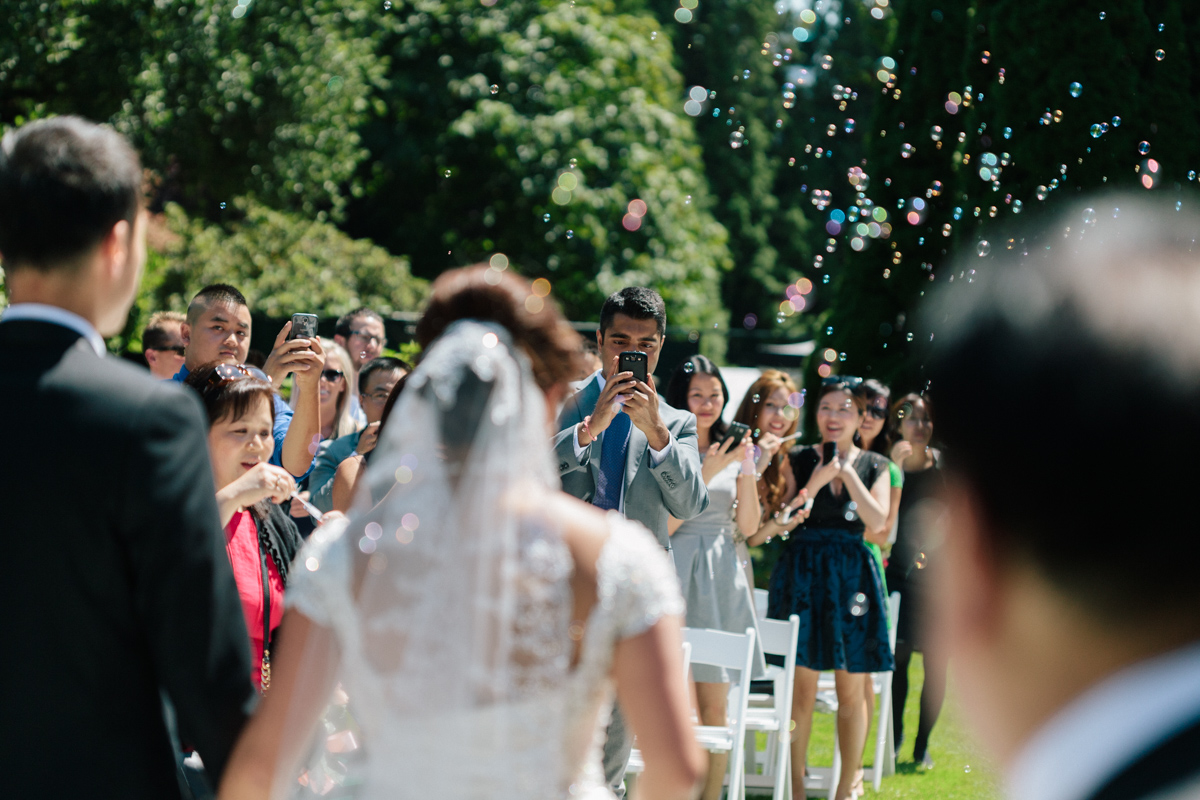 Guests taking photograph in the wedding ceremony