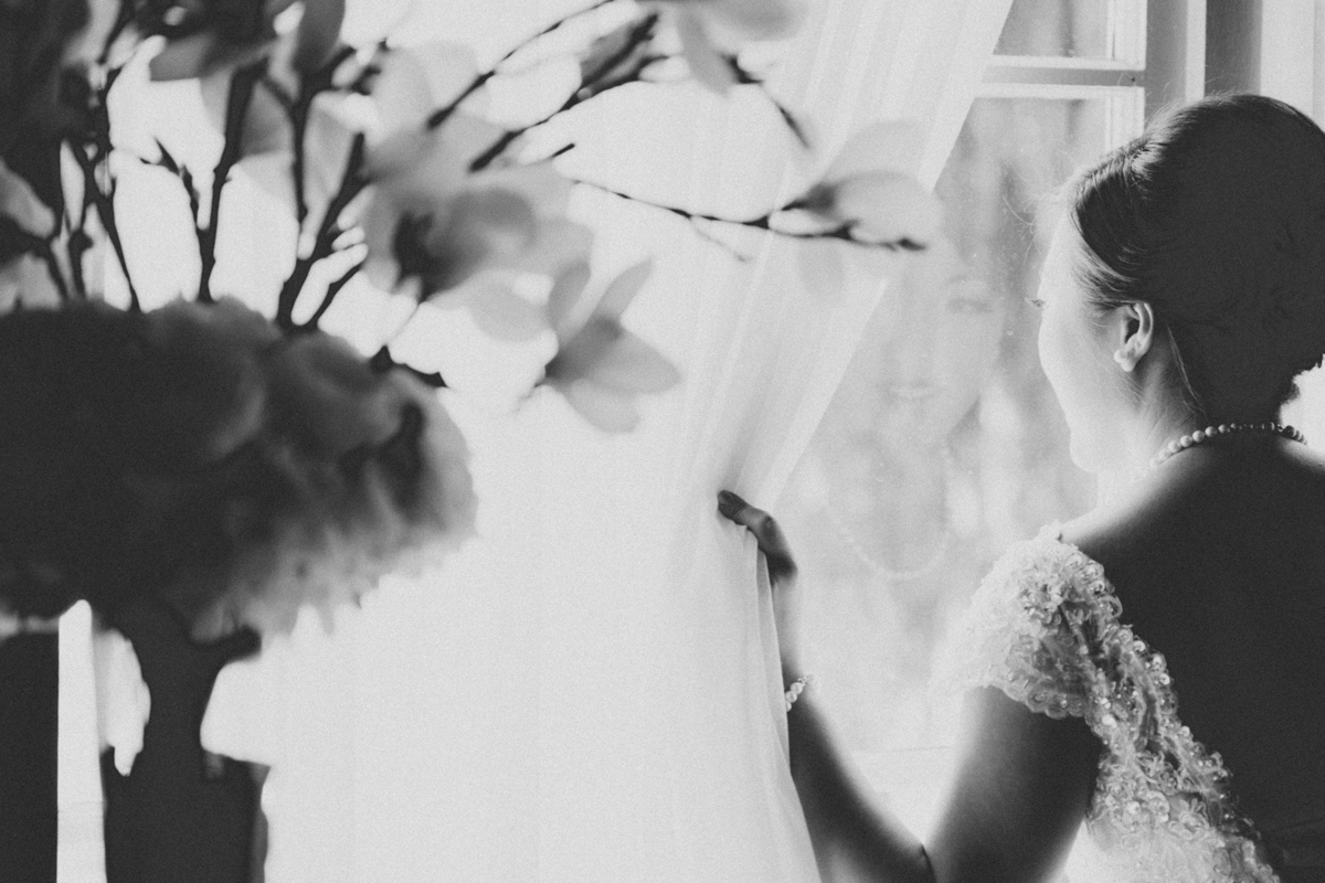 reflection of bride on the window (black and white)