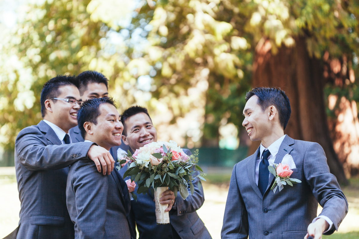 groomsmen smile exhange