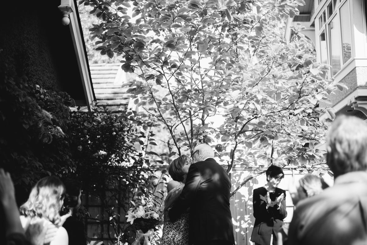 simple backyard wedding vancouver kiss