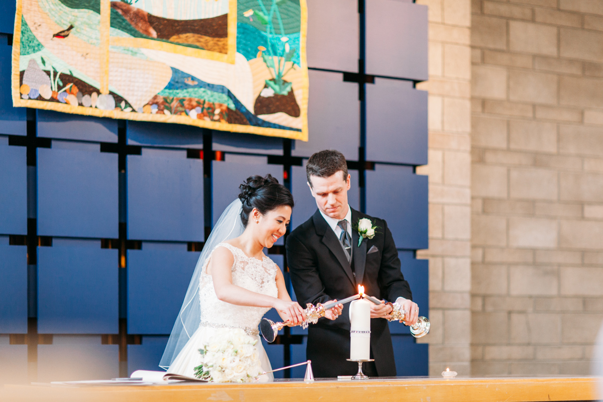 Bride and groom lighting the unity candle (Shaughnessy United Church)
