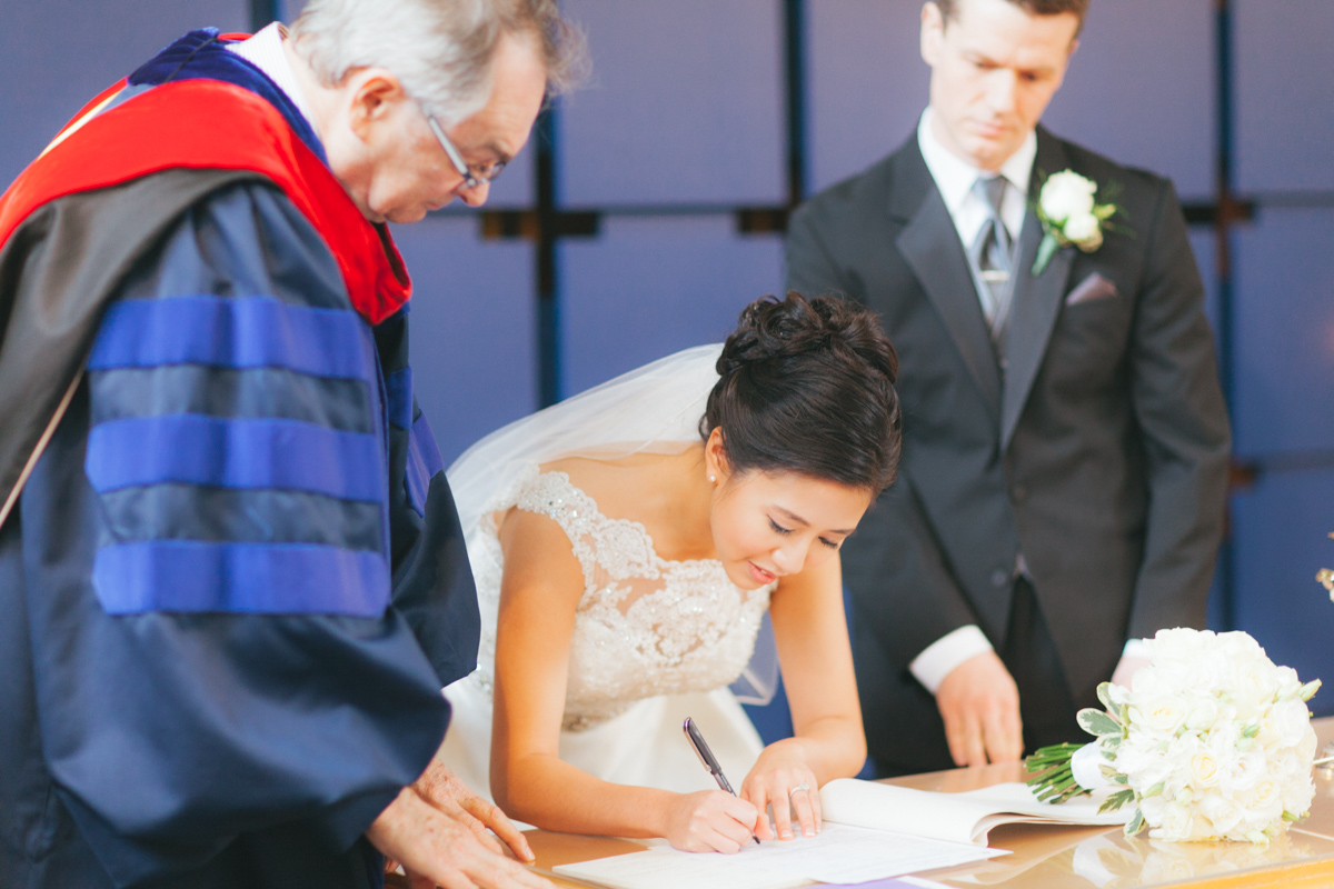 Bride signing the papers (Shaughnessy United Church)