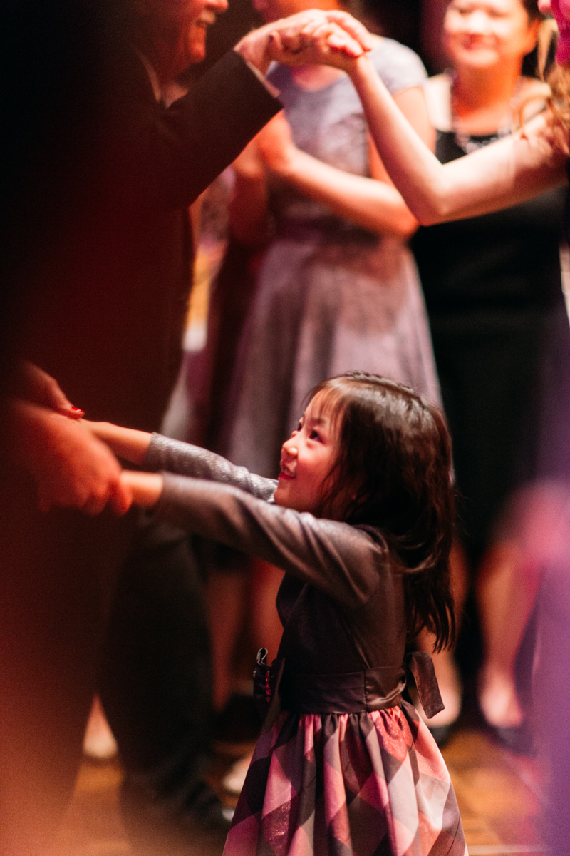 Little girl dancing in wedding banquet